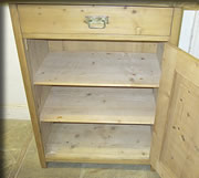 shelves inside antique pine cupboard